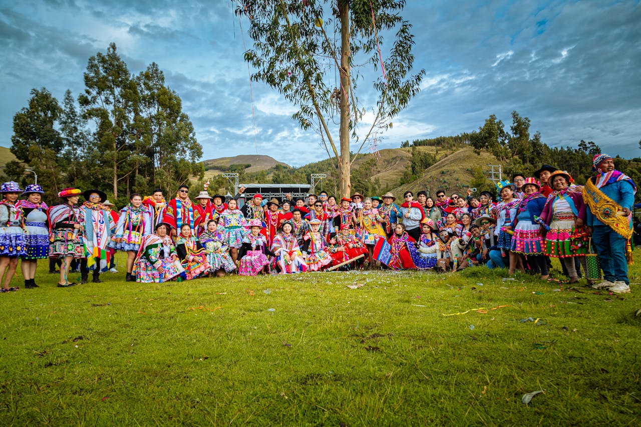 Colorful celebration with people in traditional attire in Cusco, Peru.